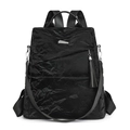 Damen Rucksack aus schwarzem Kunstleder mit Plissee-Struktur und silberner Quaste - Schwarz
