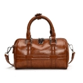 Brown Boston handbag in vintage leather texture with silver hardware and adjustable strap - Brown