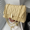 Quilted cream crossbody bag with gold chain strap and adjustable metal ball - Yellow