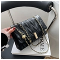 Chic black quilted crossbody bag with adjustable gold chain strap and metal buckle - Black