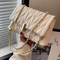 Chic quilted beige crossbody bag with gold chain strap and metal lock detail - Off White