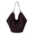 Large leopard print tote bag with brown leather handles and small charm on white background - Leopard Print