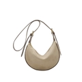 Minimalist khaki suede crescent bag with dark brown leather straps in a balanced flat lay - Off White