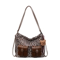 Leopard print tote bag with brown leather accents and a plush bear charm on white background - With Pendant / Off White