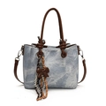 Light blue denim tote bag with brown leather handles and a decorative bow charm - With Pendant / Blue