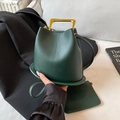 Dark green leather bucket bag with gold trapezoid handle and matching coin purse - Green