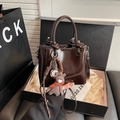 Deep brown bucket bag in glossy oily leather with cute charms and top handles - No Pendant / Brown