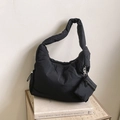 Minimalist black quilted puffer tote bag with a matching detachable coin purse charm - Black