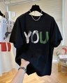 Detail of oversized black cotton T-shirt featuring artistic green and white YOU print - 3XL / Black