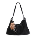 Detail of black suede hobo bag featuring plush dog pendant and textured side pleats - With Pendant / Black