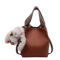 Brown litchi grain bucket bag with dark handle and grey plush bunny charm - With Charm / Brown