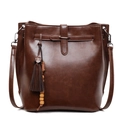 Deep brown bucket bag with leather tassels and wooden beads on a white background - Brown