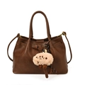 Dunkelbraune Leder-Eimertasche mit Tragegriffen, Schleifen und Schaf-Plüschanhänger - Mit Anhänger / Braun