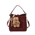 Burgundy suede bucket bag with white stitching and a cute plush bear charm accessory - With Pendant / Burgundy