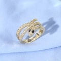 Detail of gold snake ring with micro-set zircons and black gemstone eyes on blue fabric - Black Teardrop Drill Eyes Gold Snake Style (JZ0129-1)