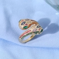 Macro detail of gold-plated double panther head ring with vibrant multicolored crystals - Leopard Heads Encounter Multicolor Pave Style (JZ0130)
