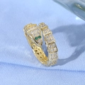 Detail of gold snake ring with white pave crystals and green marquise gem eyes - Scales Design Green Eyes Gold Snake Style (JZ0131)
