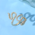 Detailed macro of golden cobra ring with sparkling zircons and green gemstone eyes - Multi-turn Entwined Green Drill Eyes Style (JZ0133)