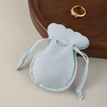 Light blue microfiber jewelry pouch with drawstring and elegant scalloped edge design - Light Blue