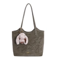 Olive green leather tote bag with long straps and a plush rabbit charm on white background - With Pendant / Green