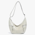 Chique beige mat leren dumpling tas met verstelbare riem en zilveren rits detail - Broken Wit