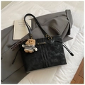 Detail of black suede tote bag with golden hardware and cute striped teddy bear charm - With Pendant / Black