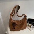 Brown retro suede crescent shoulder bag with adjustable strap and plush charm detail - With Pendant / Warm Camel Brown