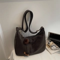 Deep brown oversized suede shoulder bag with contrast stitching and tassel charm - With Pendant / Ebony