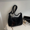 Black matte hobo shoulder bag with white stitching and brown plush ball charm - With Pendant / Black