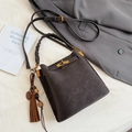 Retro dark grey frosted leather bucket bag with woven handle and tassel detail - With Pendant / Brown