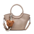 Elegant beige crossbody bag with circular handles and a cute brown plush bear pendant - Khaki