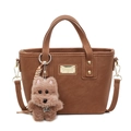 Brown faux leather bucket bag with top handle and a cute plush dog charm accessory - With Pendant / Brown