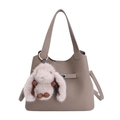 Khaki pebbled leather bucket bag with top handle and cute bunny pendant charm - With Pendant / Gray