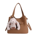 Brown litchi grain bucket bag featuring a cute grey plush bunny pendant and silver hardware - With Pendant / Brown