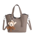 Retro khaki bucket bag in pebble leather with monkey charm and silver hardware strap - With Pendant / Gray