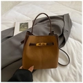 Chic two-tone brown velvet bucket bag with gold hardware and adjustable strap - Brown