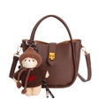 Dark brown pebble leather bucket bag with top handle and cute teddy bear charm - With Pendant / Brown