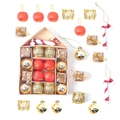 Christmas ornaments set with red globes and gold drums in a pink house-shaped box - Cane House