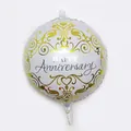 Detailed view of silver foil balloon with gold scroll patterns and Happy Anniversary text - White Anniversary