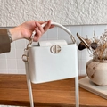 White lychee-textured boxy handbag with gold logo and detachable shoulder strap - White