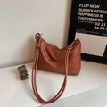 Caramel brown leather shoulder bag with chic knotted straps and vintage wide strap - Brown