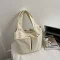 Minimalistische cremefarbene Nylon-Einkaufstasche mit zwei Fronttaschen - Cremeweiß