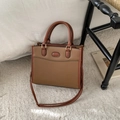 Detail of two-tone brown tote bag with premium stitching on textured PU leather - Tan