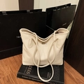 Chic beige lychee grain leather tote bag with silver logo plaque for winter 2025 - White