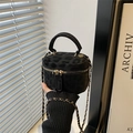 Mini leopard print suede vanity bag with chain strap and dual zippers in urban setting - Black