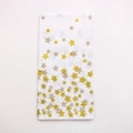 Detail of thickened rectangular tablecloth with gold and gray star patterns on white base - White Background Gold Star