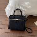 Detail of black suede and smooth leather tote bag with gold zippers on wooden floor - Without Pendant / Black