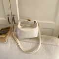 Chic beige textured faux leather pillow bag with gold clasp and adjustable strap - White