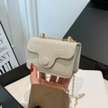 Light gray suede chain bag with scalloped stitching and gold metal shoulder strap - White