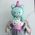 Detail of 3D mint green bear foil balloon holding a Happy Birthday cupcake decoration - Blue Bear With Cake
